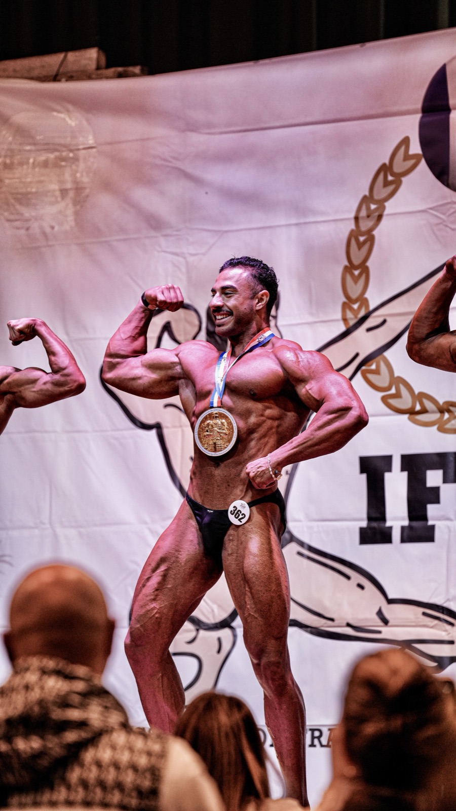 Joss on stage after winning the Champion de France IFBB title